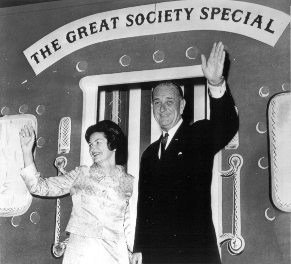 Photographic print of President and Mrs. Lyndon B. Johnson waving from the rear platform of a train car marked "The Great Society Special"