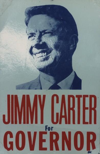 Artifact campaign poster with a blue-toned portrait of a smiling man in a suit and tie above bold red text reading "Jimmy Carter For Governor"