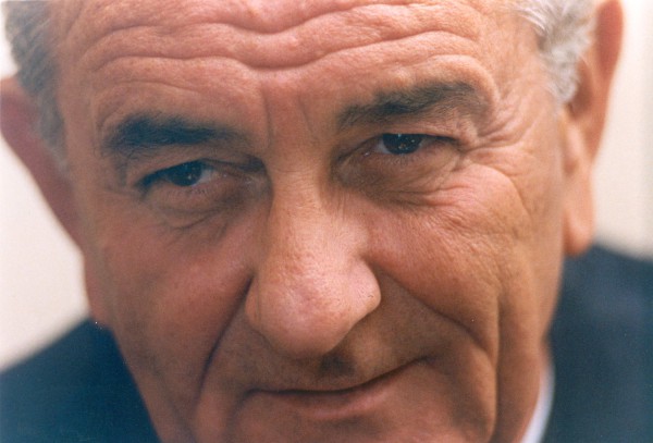 Photographic print, extreme close-up portrait of President Lyndon B. Johnson, an older man with gray hair, blue eyes, and a slight smile