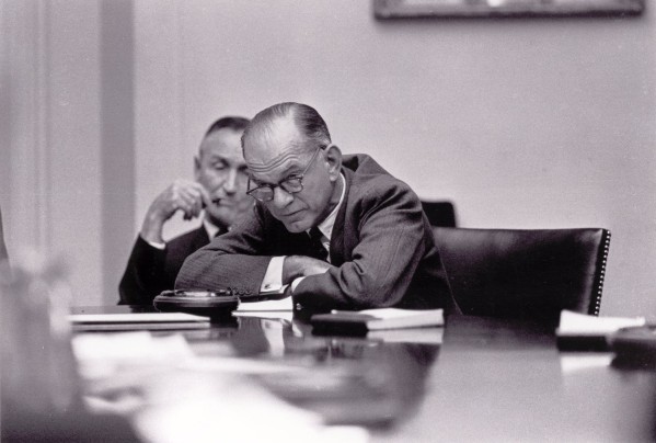 Photographic print of Senators Mike Mansfield and William Fulbright seated at a large conference table in the White House Cabinet Room, both in suits